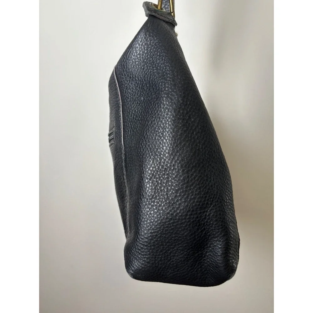 The Sak Alameda Hobo Bag Medium Black Pebbled Leather Feather Fringe Charm